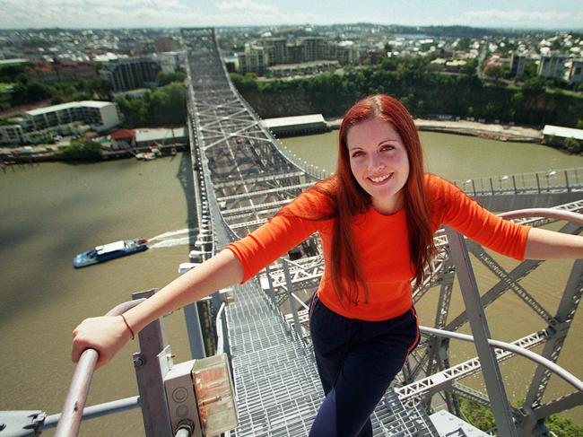 Brisbane City Council employee Kirsty Scharneck atop the Story Bridge in 2001 as council throws it open to bridge climbing businesses.