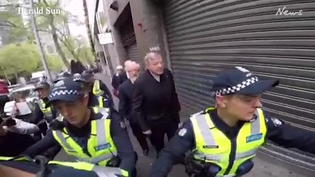 Cardinal George Pell arrives at court in Melbourne 