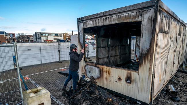 A torched drive-in coronavirus test centre in the port Urk, after protesters went on a rampage protesting the first night time curfew in the Netherlands since the occupation during World War II. Picture: Jeroen Jumelet/ANP/AFP