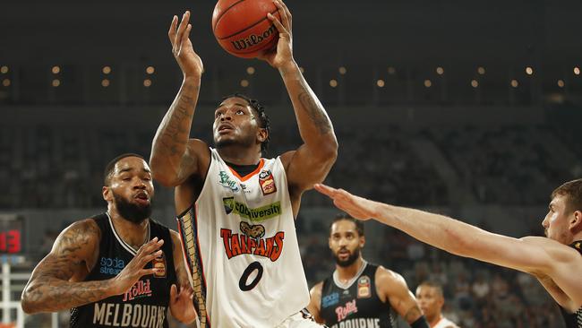 MELBOURNE, AUSTRALIA – FEBRUARY 13: Cameron Oliver of the Taipans drives to the basket under pressure from Shawn Long of United (L) and Mitch McCarron of United during the round 20 NBL match between Melbourne United and the Cairns Taipans at Melbourne Arena on February 13, 2020 in Melbourne, Australia. (Photo by Daniel Pockett/Getty Images)