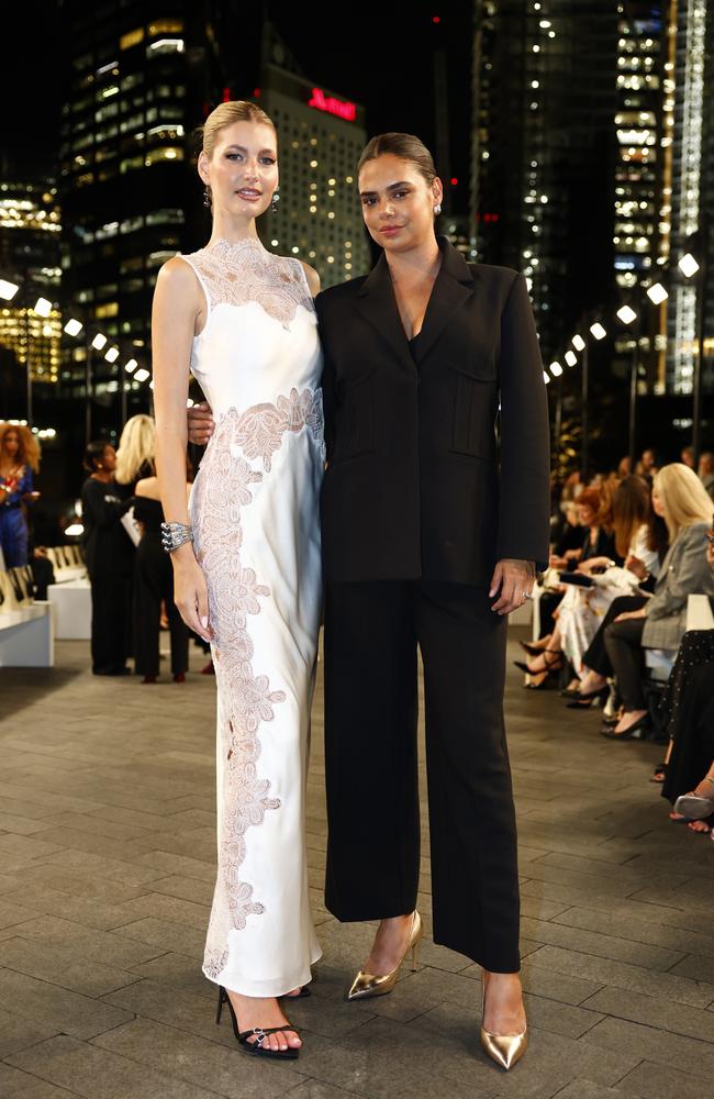 Models Mary Vitinaros and Samantha Harris at the Carla Zampatti 60th anniversary runway show, during Australian Fashion Week 2025 at the MCA Lawn in The Rocks. Picture: Jonathan Ng