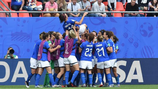 Italian players throw Barbara Bonansea in the air in celebration of the win. Picture: Getty Images