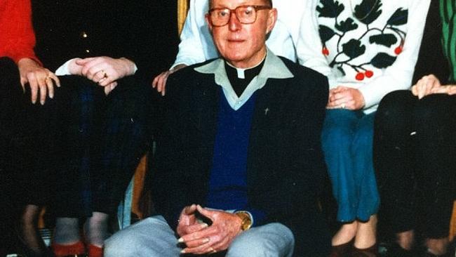 Priest Peter Searson in a school staff photograph.