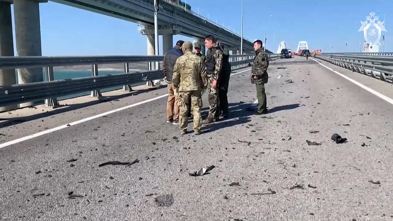 Russian Investigative Committee investigators working on the Kerch bridge. Picture: Russian Investigative Committee / AFP