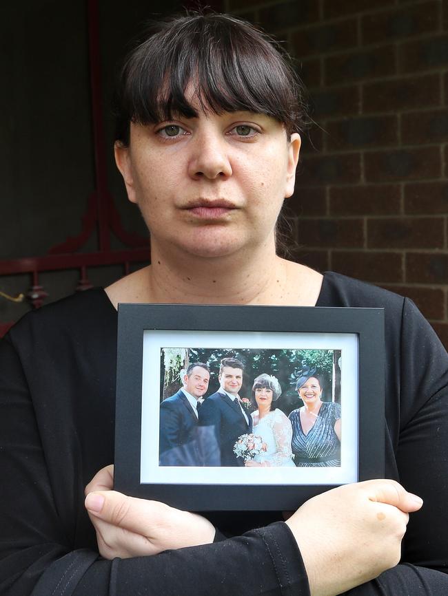 Apollo’s younger sister, Bianca Becker, holding a photo from her wedding with Apollo on the left. Picture: Hamish Blair