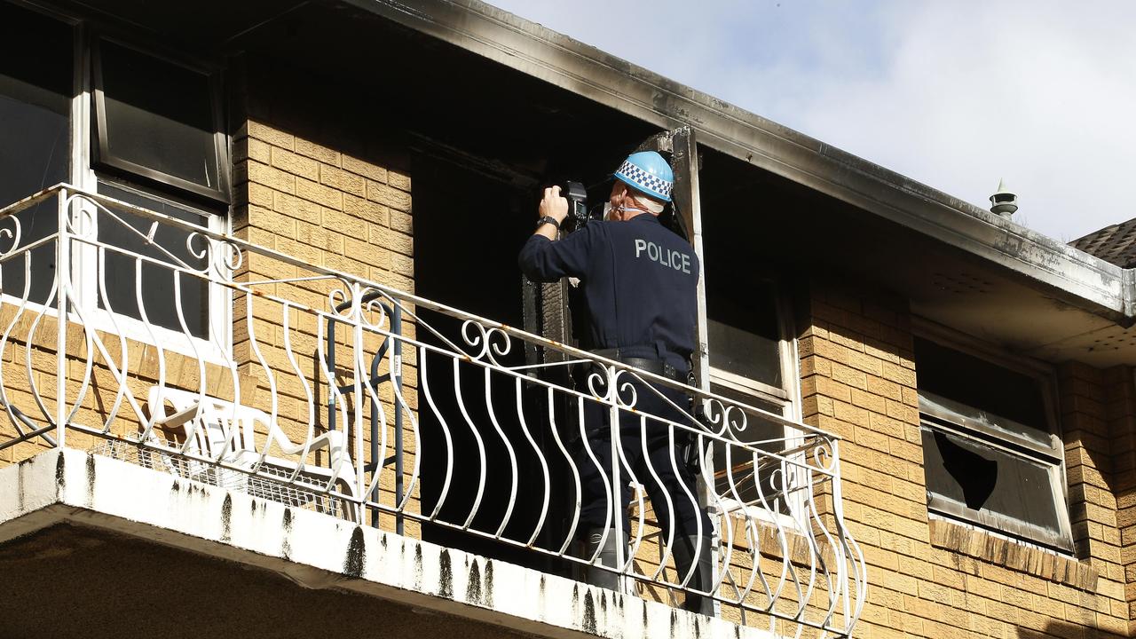 Police launched an investigation at the unit where a fatal fire began. Picture: John Appleyard