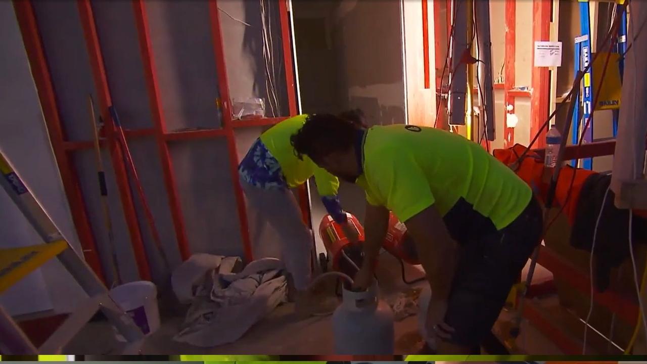 Ronnie helps Vito finish sanding his bathroom. Picture: Supplied Channel 9