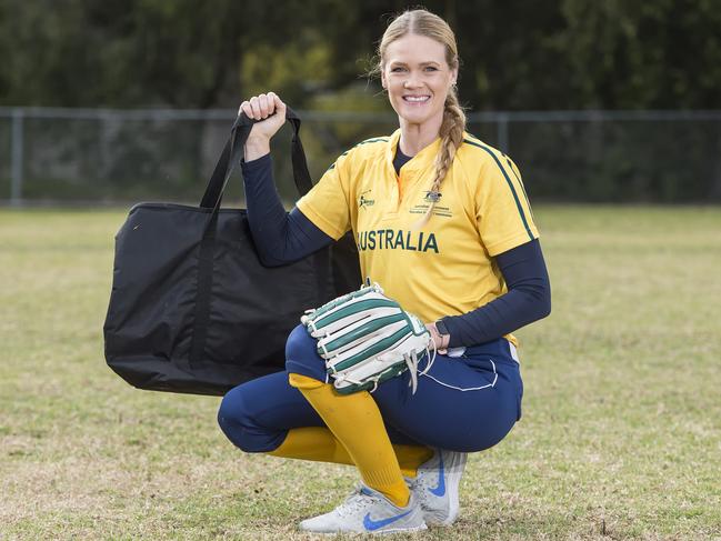 HORNSBY ADVOCATE/AAP. Australian professional softballer Ellen Roberts poses during a photo shoot at Westleigh on Friday, August 23.  She is one of our top players and also, in her spare time, delivers for Uber eats. (AAP IMAGE / Troy Snook)