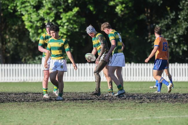 The cricket pitch on Ashgrove’s main oval was a mud bath. Picture by Stephen Archer