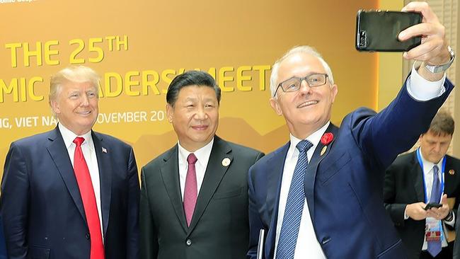 Malcolm Turnbull (right) takes a selfie with US President Donald Trump and China's President Xi Jinping at the APEC economic leaders' meeting in the Vietnamese city of Da Nang in 2017.