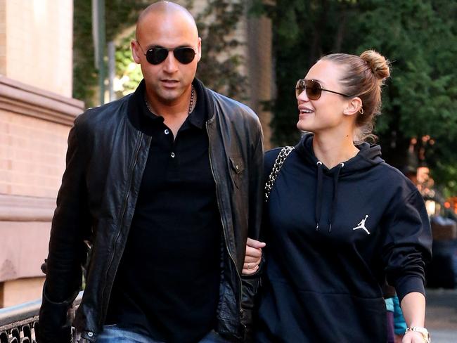 Loved up ... Hannah Davis (right) is dating retired New York Yankees star Derek Jeter. Picture: Splash News