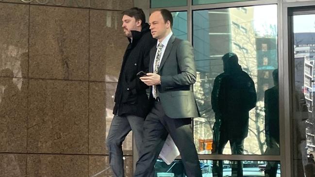 David Alex Harvey (left) leaving Melbourne Magistrates' Court with his lawyer on Wednesday after he admitted selling fake F1 tickets. Picture: Miles Proust,