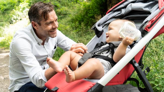 Evans with his youngest son in Stabio, Switzerland, in 2021. Picture: Supplied