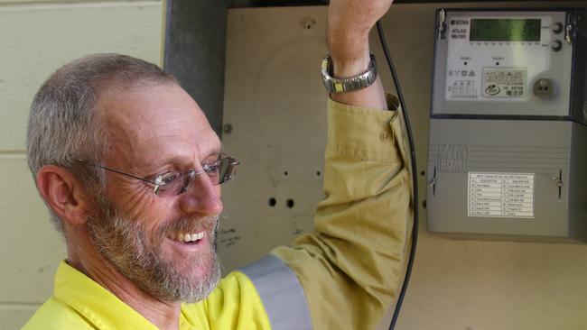 Ergon Regional Metering officer Niels Ederveen with a digital meter.