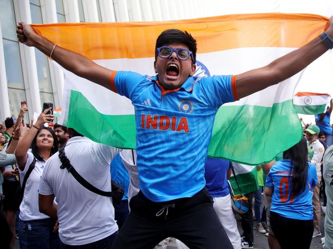 Supporters of India celebrate their victory at the Oculus in Lower Manhattan after watching the ICC men's Twenty20 World Cup 2024 group A cricket match between India and Pakistan, in New York City on June 9, 2024. (Photo by Leonardo Munoz / AFP)