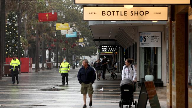 Northern beaches council rangers on patrol in Manly Corso reminding people of the health orders that were put in place at 5pm on Saturday. Picture: Damian Shaw