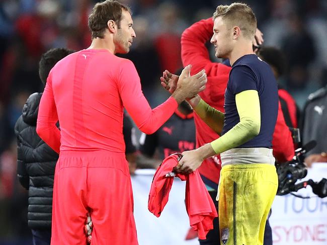 Petr Cech of Arsenal congratulates Andrew Redmayne of Sydney FC.