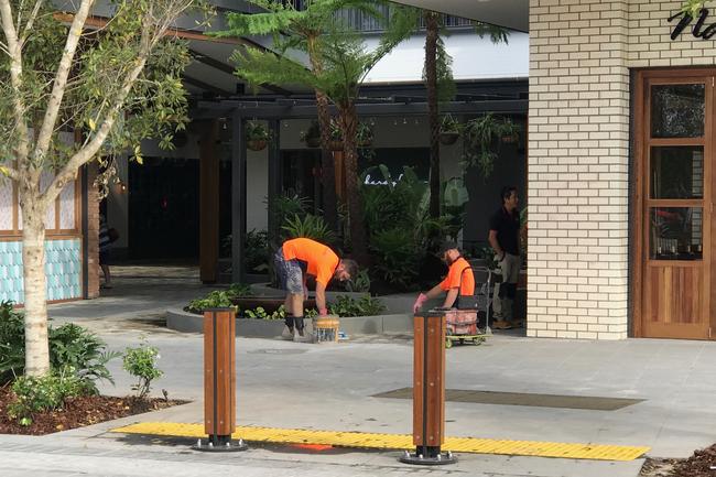 Workers putting the finishing touches on the Westfield Coomera at Coomera Town Centre