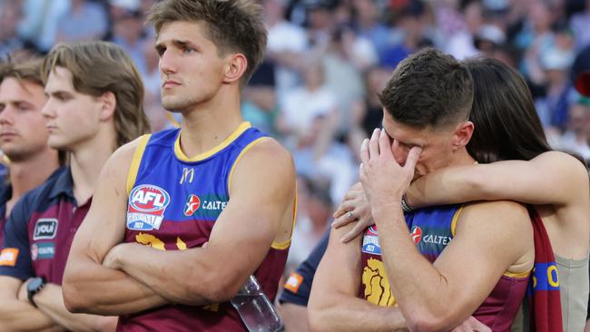 Zorko is comforted by partner Talia De Marco after the siren at the 2023 AFL Grand Final. Picture Lachie Millard