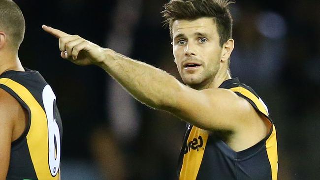 MELBOURNE, AUSTRALIA - APRIL 09: Trent Cotchin, captain of the Richmond Tigers directs his teammates during the round three AFL match between the Richmond Tigers and the Adelaide Crows at Etihad Stadium on April 9, 2016 in Melbourne, Australia. (Photo by Scott Barbour/Getty Images)