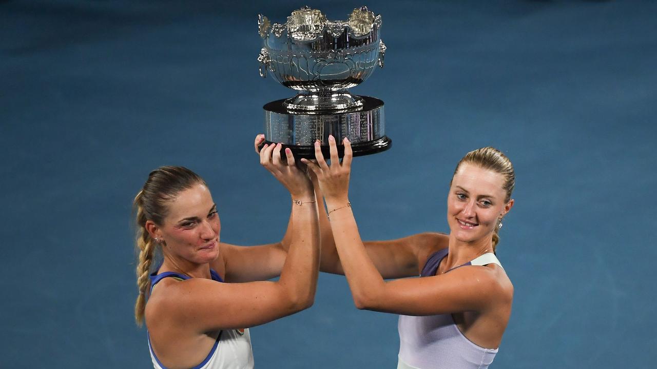 Hungary's Timea Babos (L) and France's Kristina Mladenovic (R) with the Australian Open trophy in 2020. The pair have been withdrawn from the US Open.