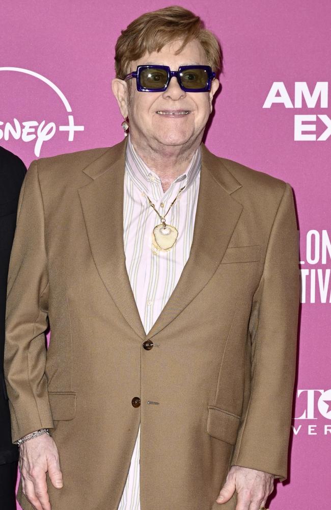 Elton John attended a red carpet wearing a necklace made of his own kneecap. Photo: Gareth Cattermole/Getty Images for BFI.