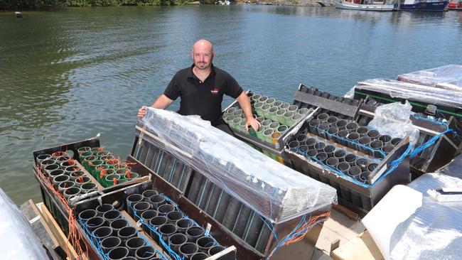 Nick Kozij, manager of Skylighter Fireworks, with a barge full of fireworks. Picture Glenn Hampson