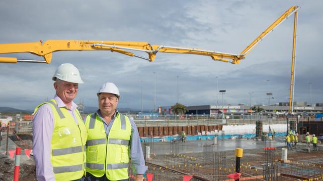 Condev Construction executive chairman Steve Marais (left) and Queensland Airports Limited executive general manager property and infrastructure Carl Bruhn and in front of the slab now laid for the Gold Coast Airport's first hotel, a $50 million Rydges scheduled to open mid-2020. Picture: Fotomedia