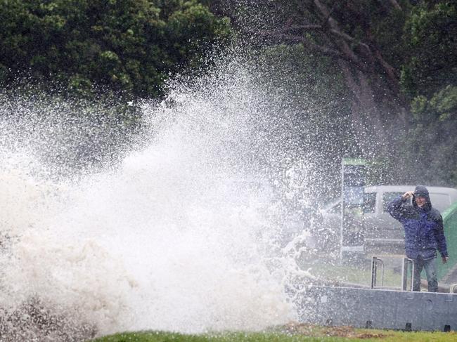 AUCKLAND, NEW ZEALAND - FEBRUARY 13: People out looking at the effects of Cyclone Gabrielle at Mathesons Bay Beach on the Matakana Coast on February 13, 2023 in Auckland, New Zealand. Forecasters say Auckland residents are about halfway through the cyclone impacts, with a better weather forecast from Wednesday. (Photo by Fiona Goodall/Getty Images) on February 13, 2023 in Auckland, New Zealand.  (Photo by Fiona Goodall/Getty Images)