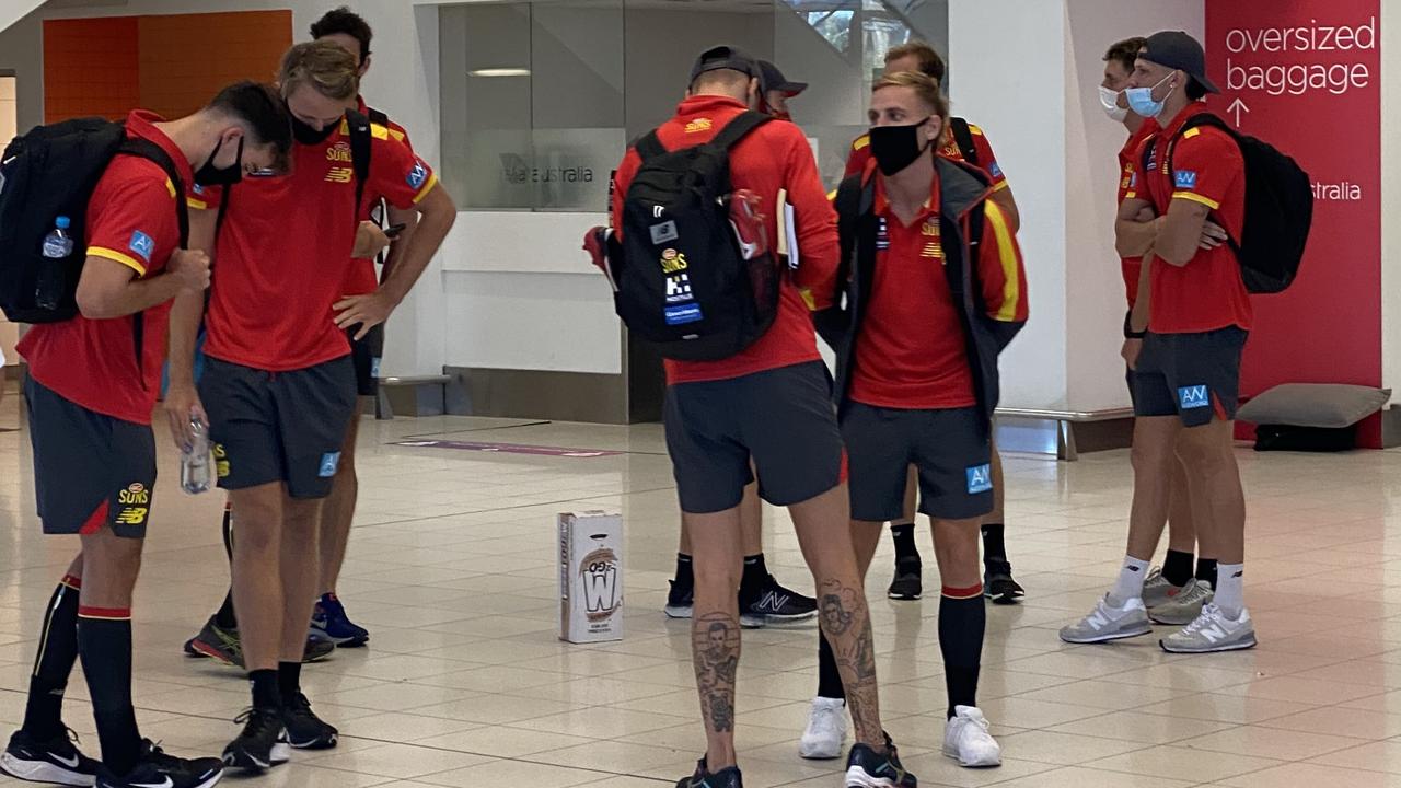 Gold Coast players were required to wear masks during their flight.