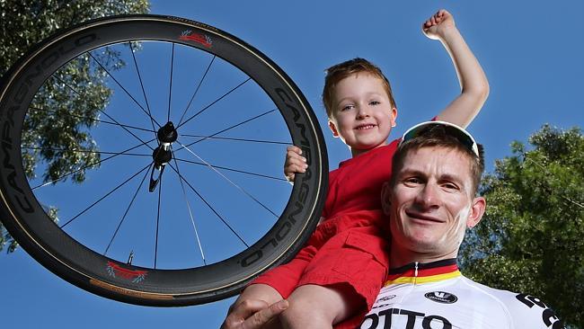 ABOVE IT ALL: Young fan Sam welcomes Andre Greipel to Adelaide ahead of the Tour Down Under. Picture: SARAH REED.