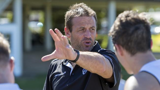 Southport’s Matt Primus chats to the players. Picture credit: TJ Yelds, NEAFL.