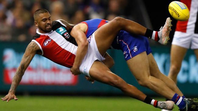 Brad Hill gets crunched in a tackle by Bailey Smith.