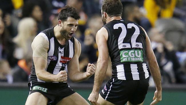 Alex Fasolo celebrates a goal with Steele Sidebottom.