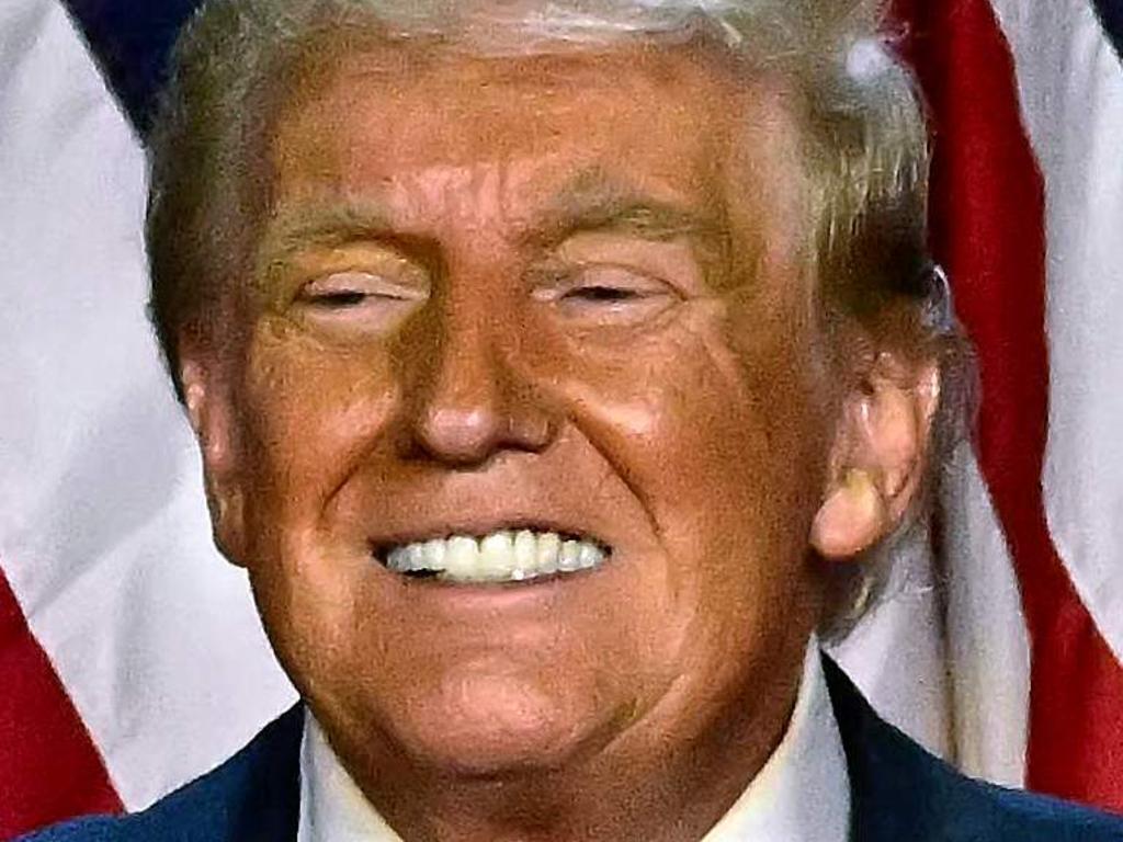 Former US President and Republican presidential candidate Donald Trump and former US First Lady Melania Trump smile after speaking during an election night event at the West Palm Beach Convention Center in West Palm Beach, Florida, early on November 6, 2024. Republican former president Donald Trump closed in on a new term in the White House early November 6, 2024, just needing a handful of electoral votes to defeat Democratic Vice President Kamala Harris. (Photo by Jim WATSON / AFP)