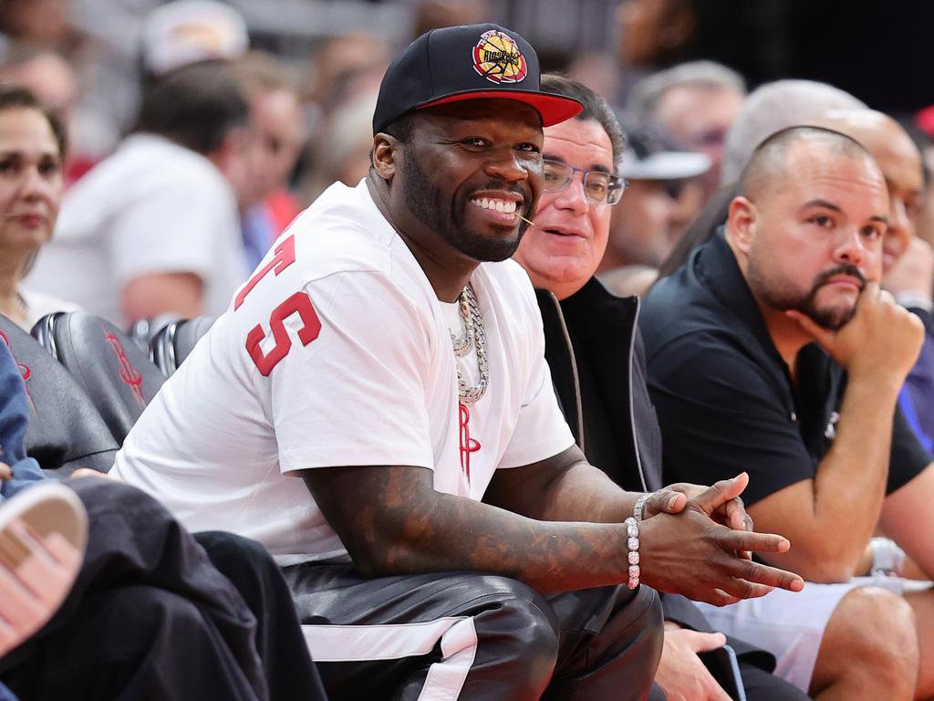 50 Cent smiles during a game between the Houston Rockets and Charlotte Hornets in Texas. Picture: Alex Slitz/Getty Images