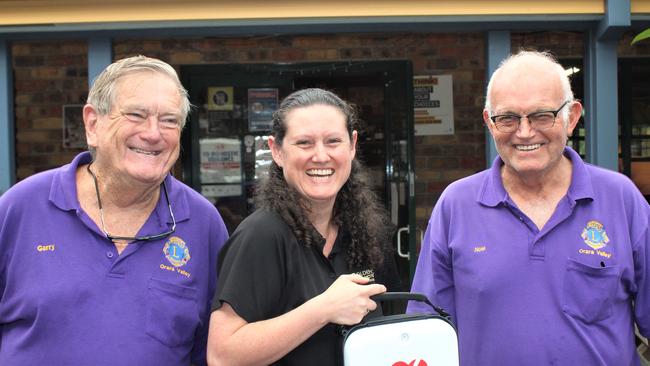 Orara Valley Lions Club president Gary Elston, Golden Dog Hotel owner Stephanie Luck and club secretary Noel Backman with the new defibrillator. Photo: Tim Jarrett