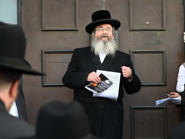 Chief Rabbi Shlomo Kohn blessed the items that were burned in the fire. Picture: Tony Gough