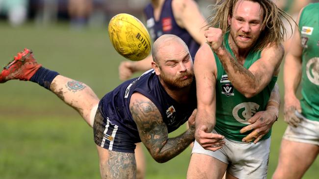 Seville and Gembrook Cockatoo do battle on Saturday. Picture: Stuart Milligan