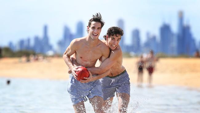 Ben and Max King have some fun on Brighton Beach. Picture: David Caird