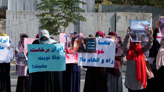 Afghan women hold placards as they take part in a protest in front of the Iranian embassy in Kabul on Thursday. Picture: AFP