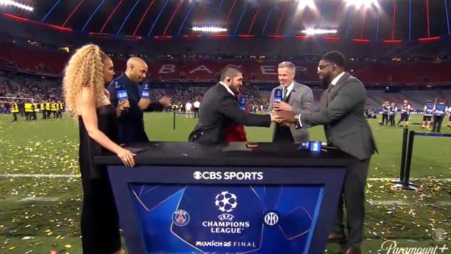 Khabib Nurmagomedov shakes hands with Micar Richards.