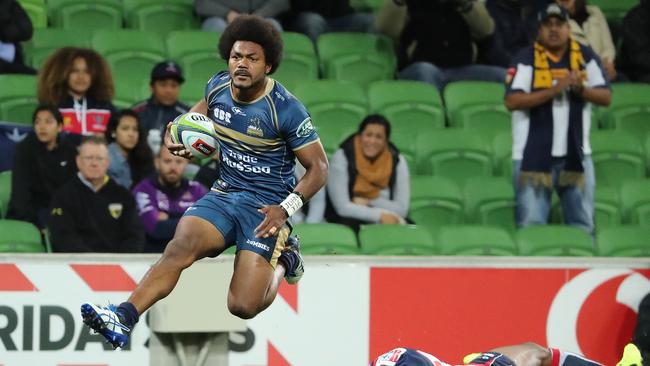 Henry Speight of the Brumbies runs in to score a try.