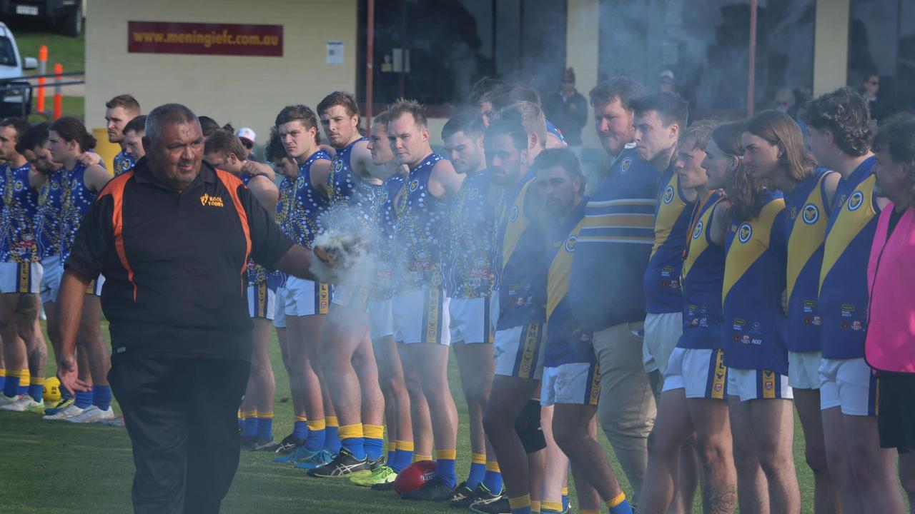 Meningie players are part of a smoking ceremony by elder Mark Koolmatrie.Picture: Supplied/Jodie Jaensch