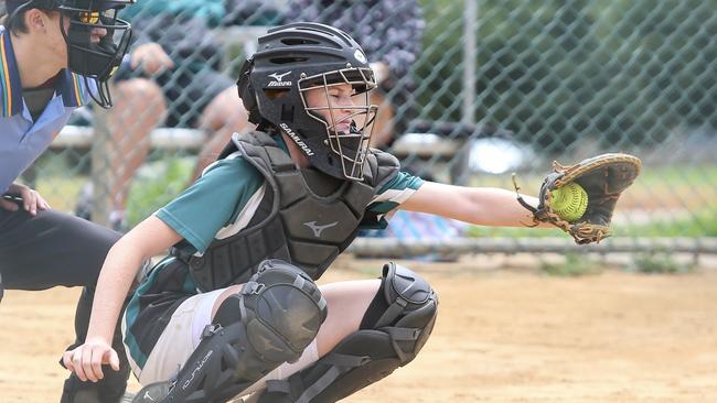 Evie King fielding as catcher for the Warriors. Photo: Julie Cooper Photography.