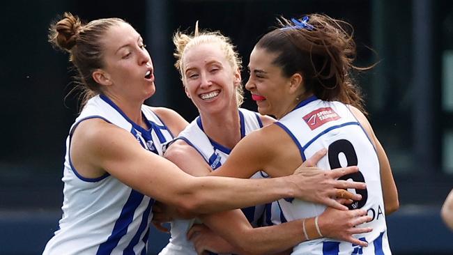 MELBOURNE, AUSTRALIA - NOVEMBER 12: (L-R) Emma King, Kate Shierlaw and Taylah Gatt of the Kangaroos celebrate during the 2023 AFLW Second Qualifying Final match between The Melbourne Demons and The North Melbourne Tasmanian Kangaroos at IKON Park on November 12, 2023 in Melbourne, Australia. (Photo by Michael Willson/AFL Photos via Getty Images)