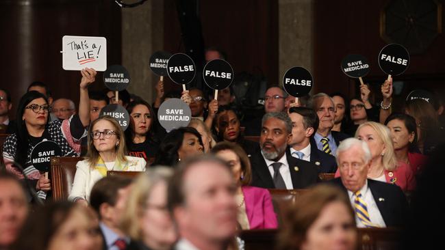 Democrats hold protest signs during a joint session of Congress at the US Capitol in Washington, DC, on March 4, 2025. Picture: Win McNamee/Pool/AFP