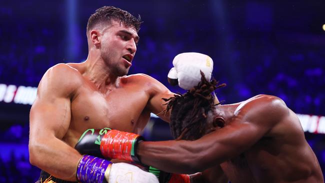 Tommy Fury punches KSI. Photo by Matt McNulty/Getty Images.