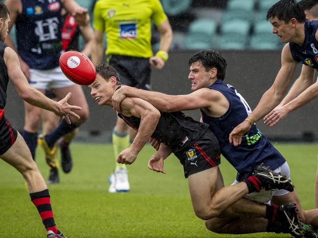 North Launceston’s Jack Avent, centre, is tackled high. Picture: LUKE BOWDEN