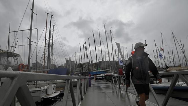 A man walks off a pontoon after the cancellation of the Sydney to Hobart yacht race due to an escalating coronavirus outbreak in 2020.